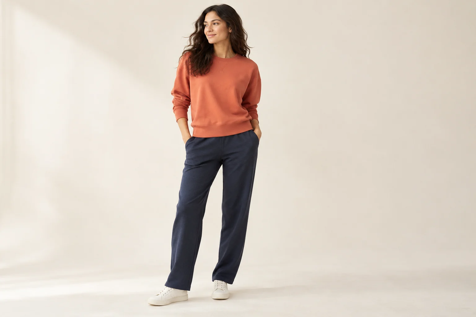 Woman wearing an orange sweatshirt